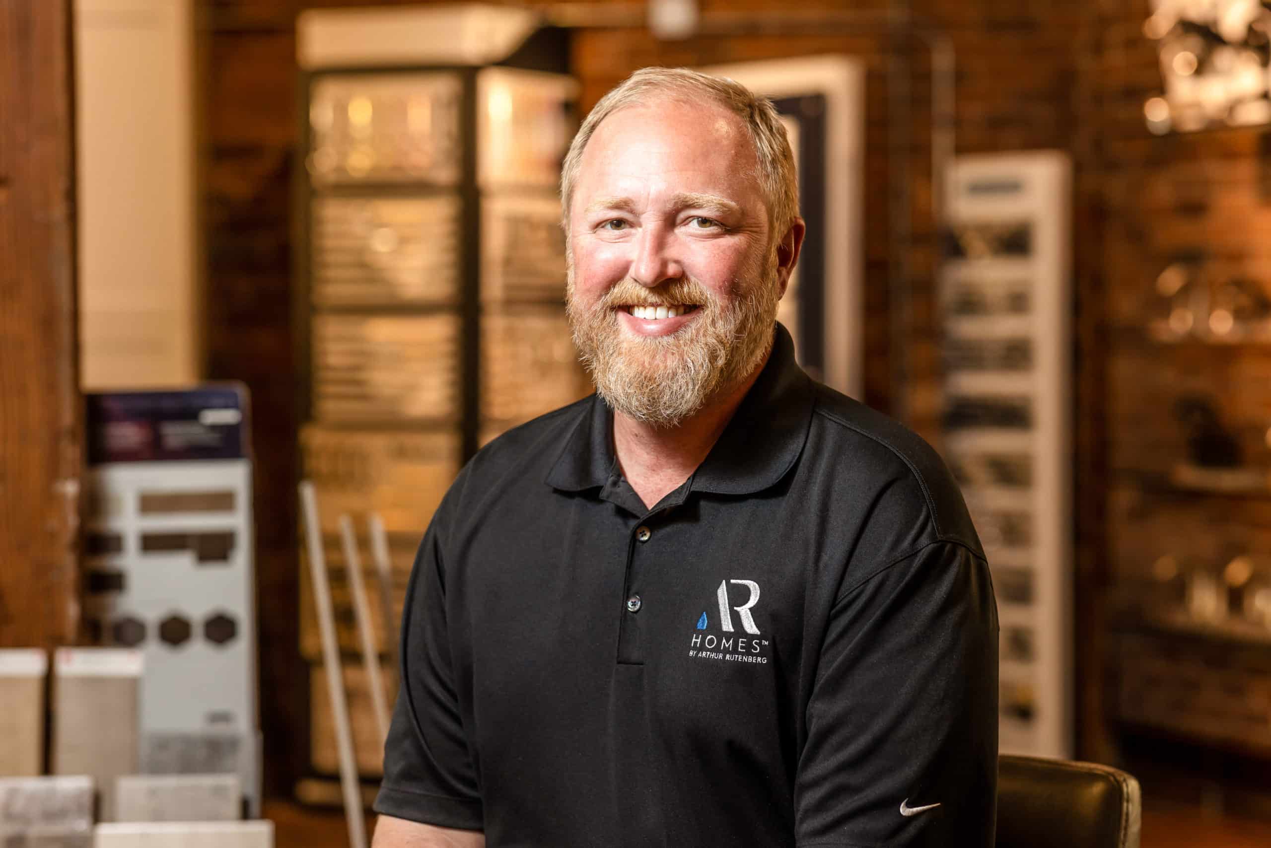 Headshot of man in AR Homes polo