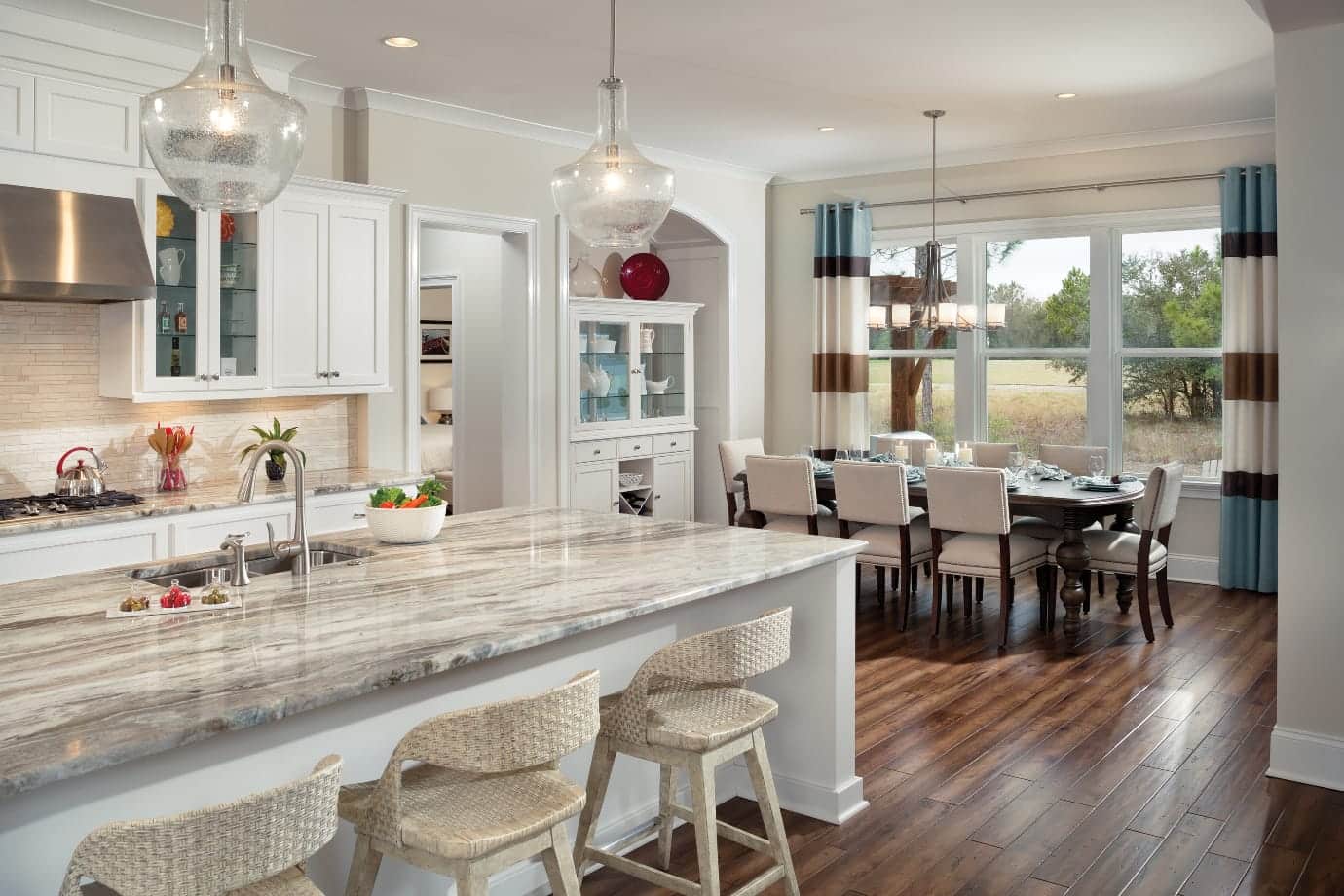 dining room table behind kitchen island