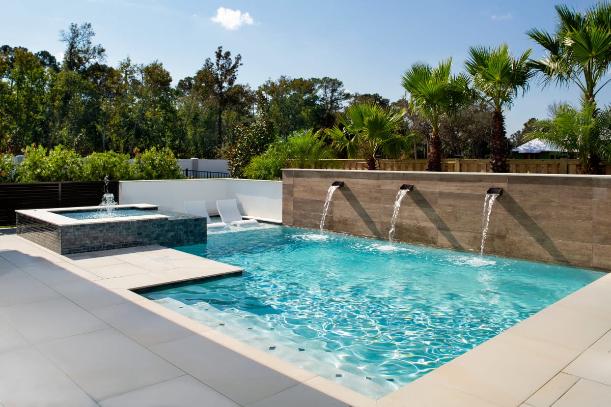 outdoor pool with fountain ledge