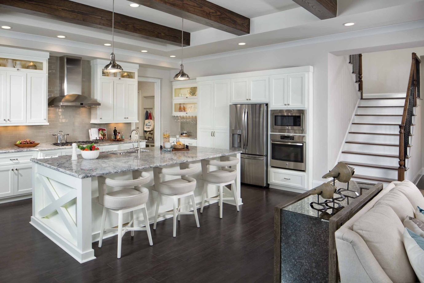 model home kitchen island by staircase