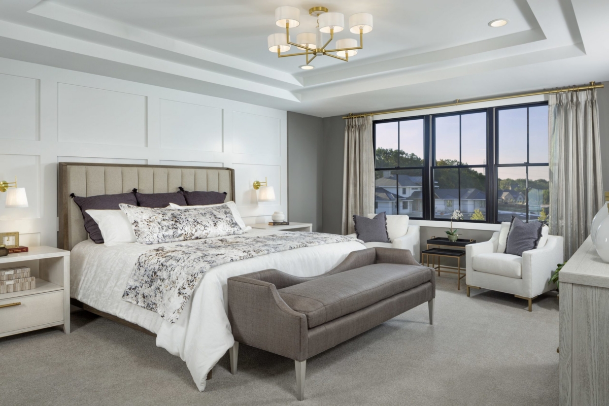 Owner's suite with sitting area and king bed