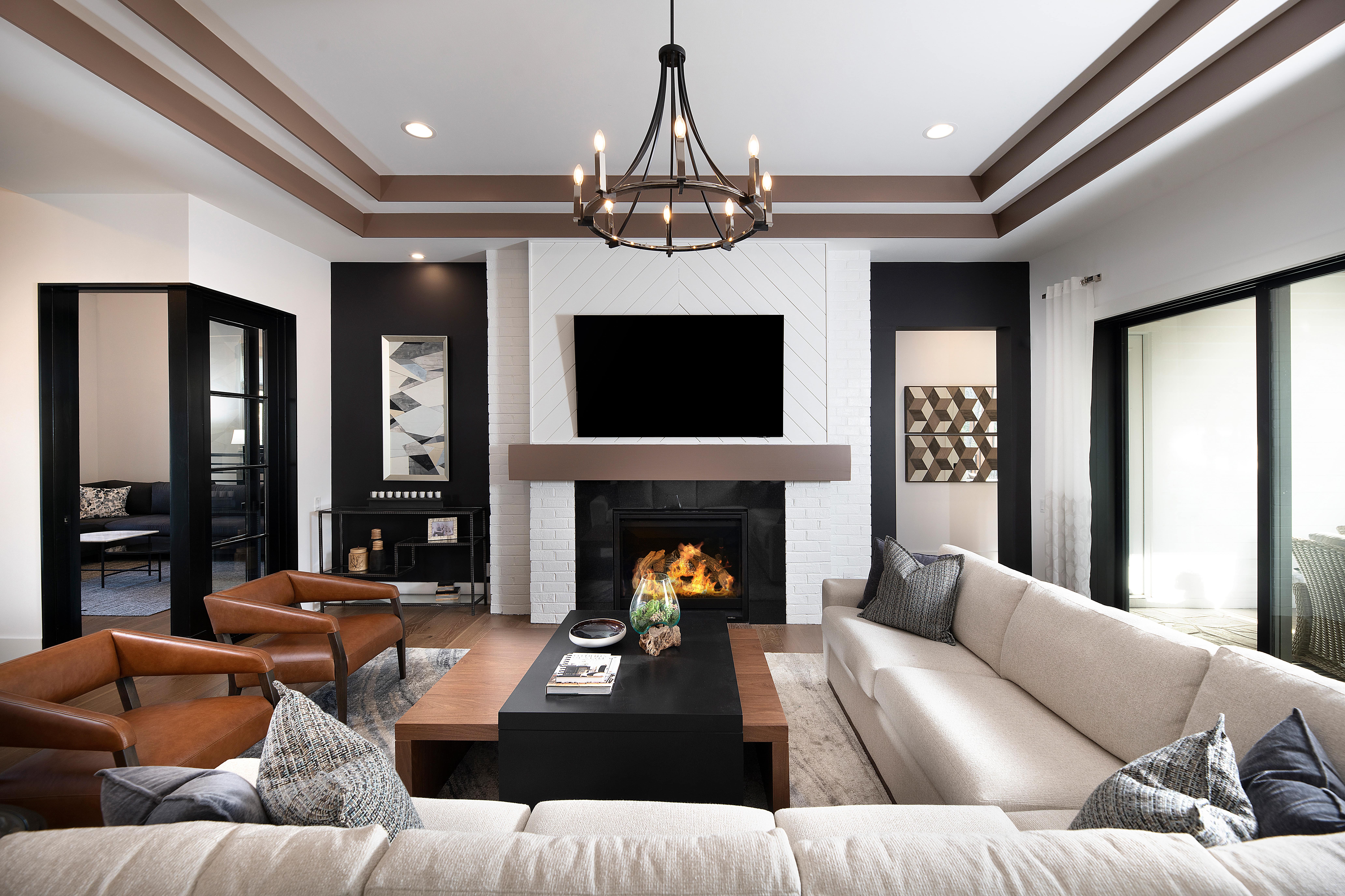 great room couch overlooking fireplace and coffee table