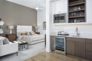 Guest Suite wet bar and bedroom bed view