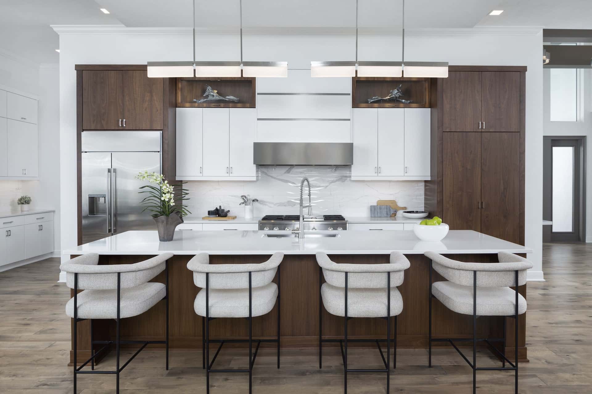 Ocala Custom Kitchen featuring Luxury White Stools on Chocolate Cabinetry - A Beautiful Palette Chosen by Central Florida Home Builders