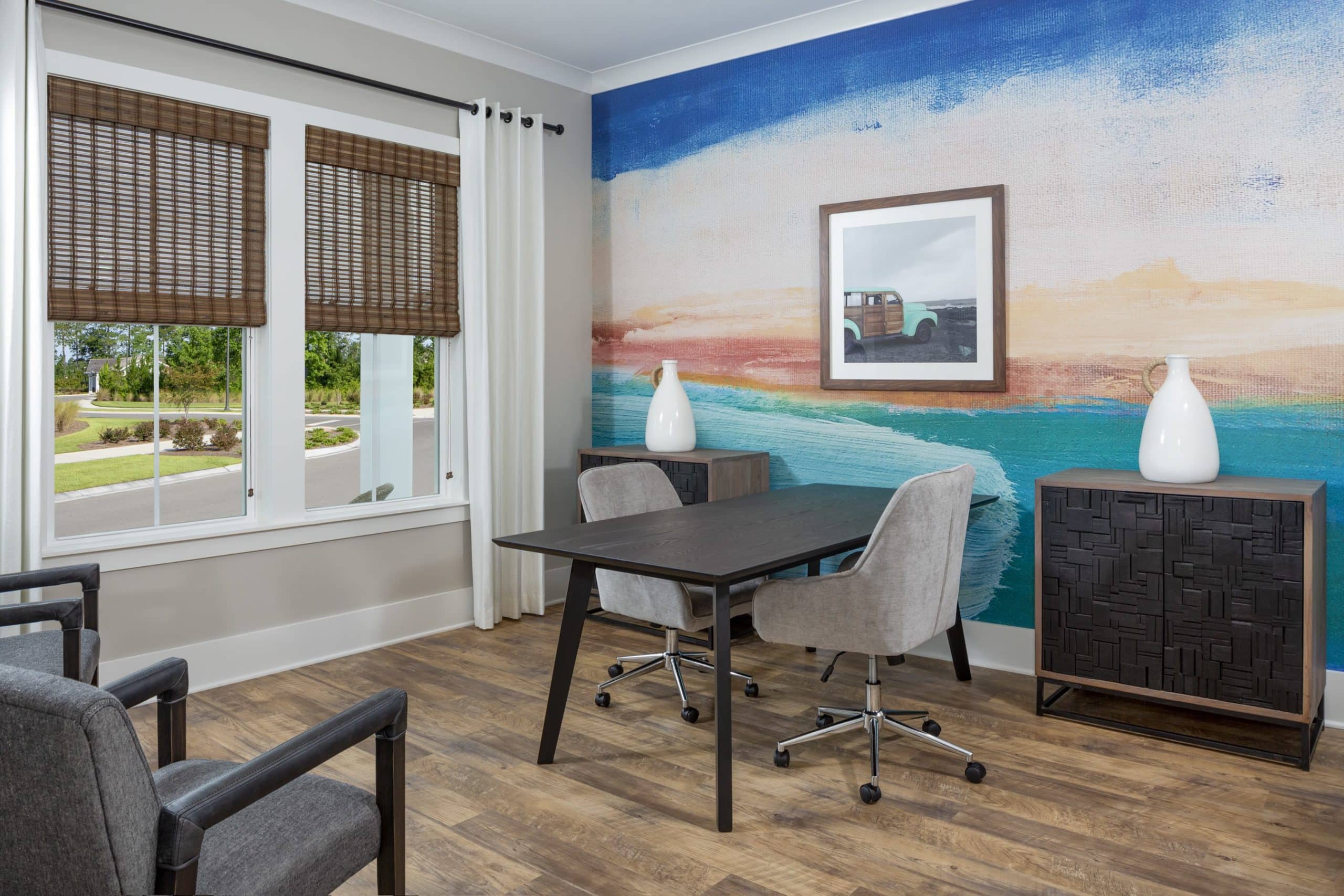 study room desk by seaside mural and windows