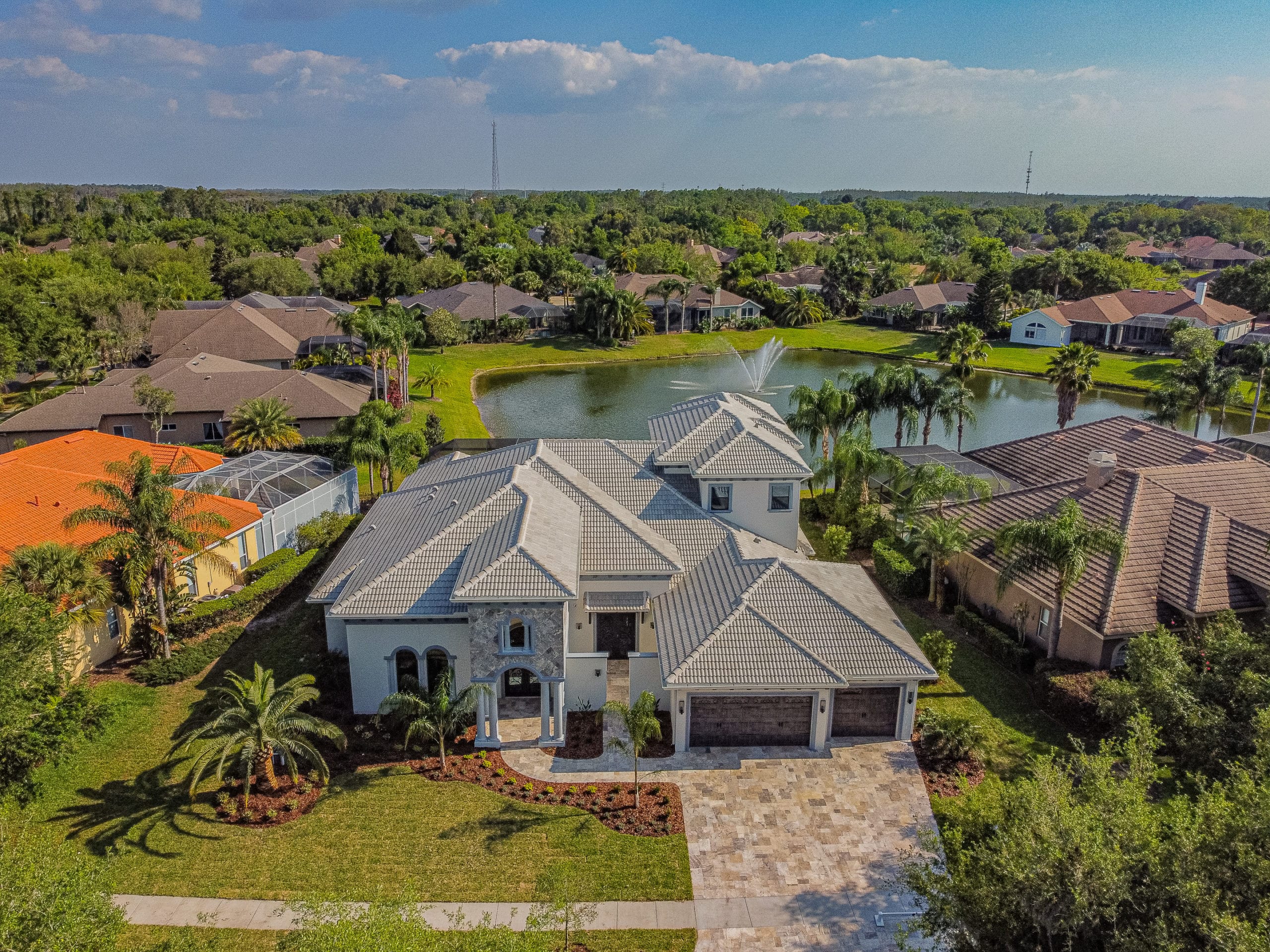 aerial of custom home in lakeside community