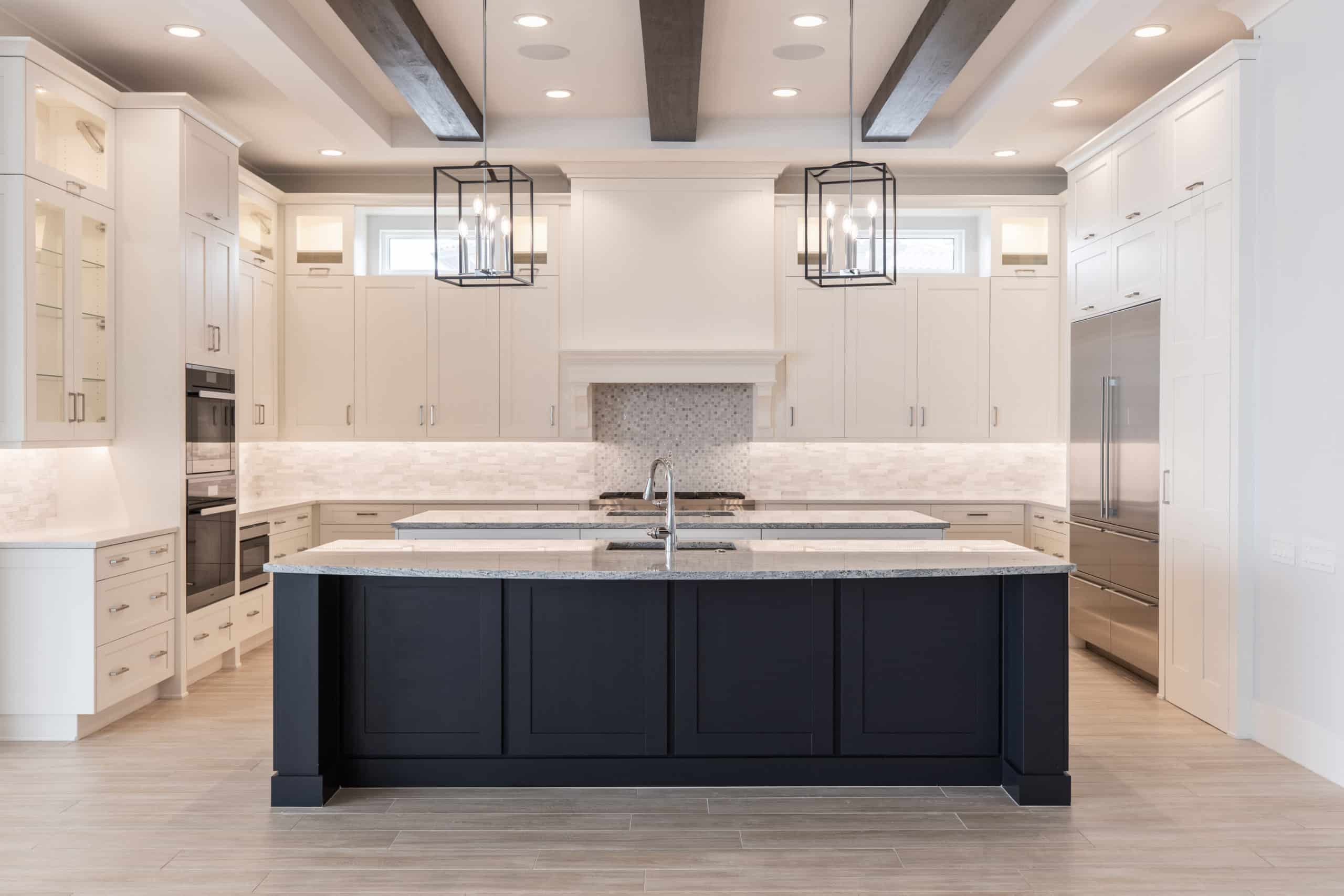 custom hallier kitchen with large island and modern metal lighting