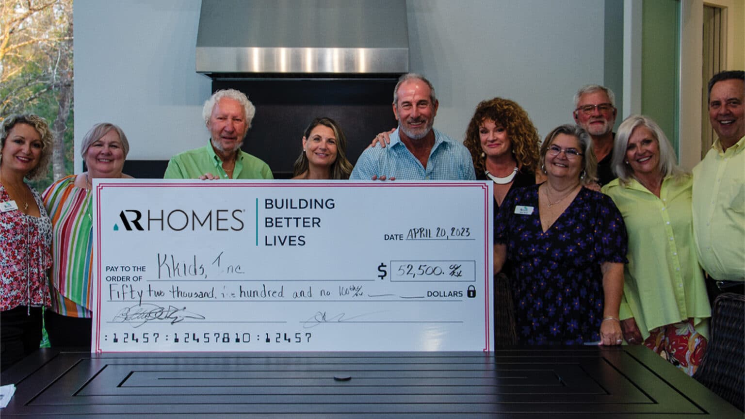 Kkids, Inc. receives 52,500 check from AR Homes® Franchises