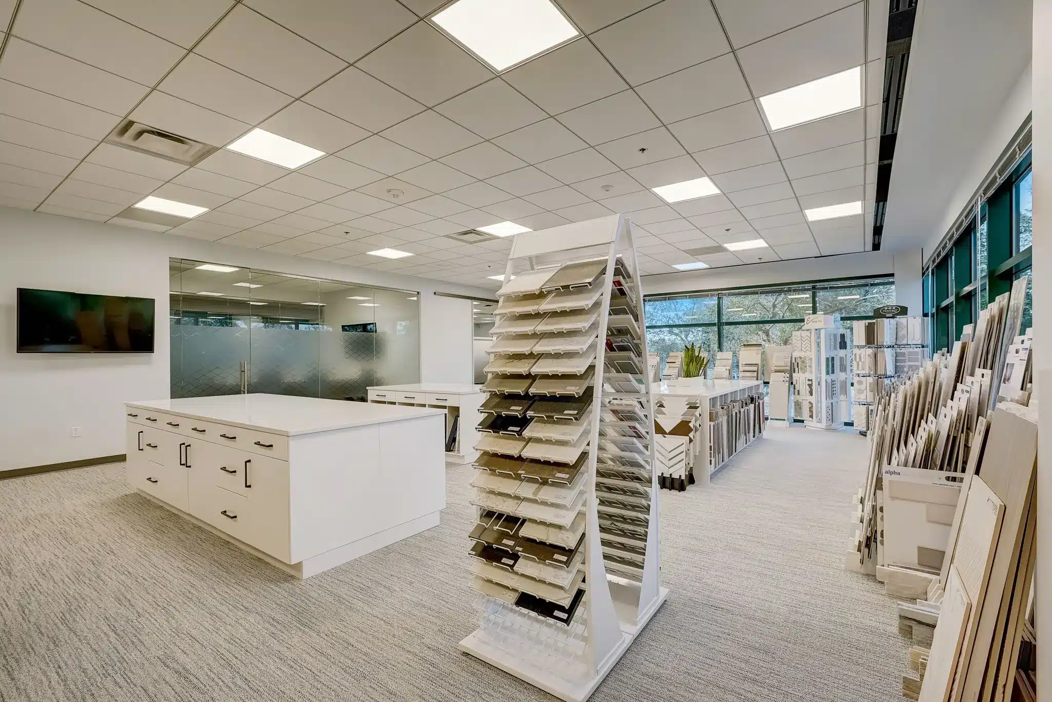 Interior design studio in St. Petersburg, Florida, large work table, display racks with sample tile materials